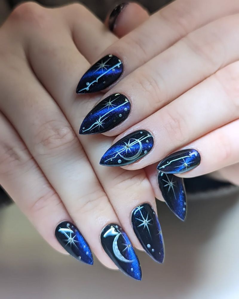 stiletto nails, magnetic blue nail polish, silver moon and stars