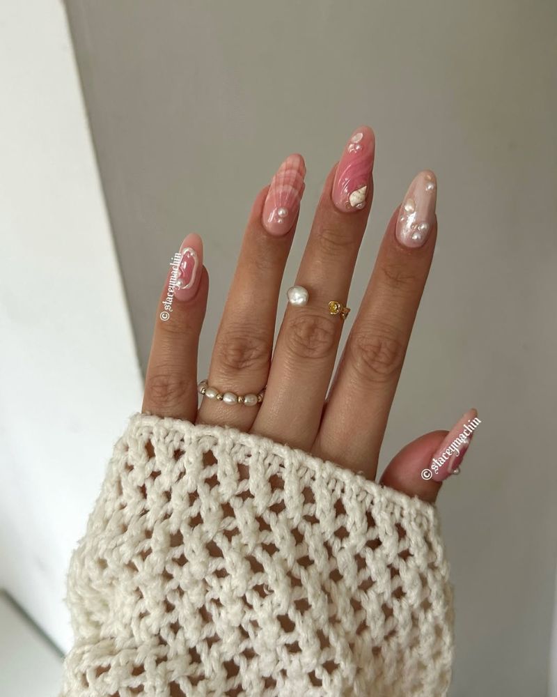 light pink summer nails with seashells nail art