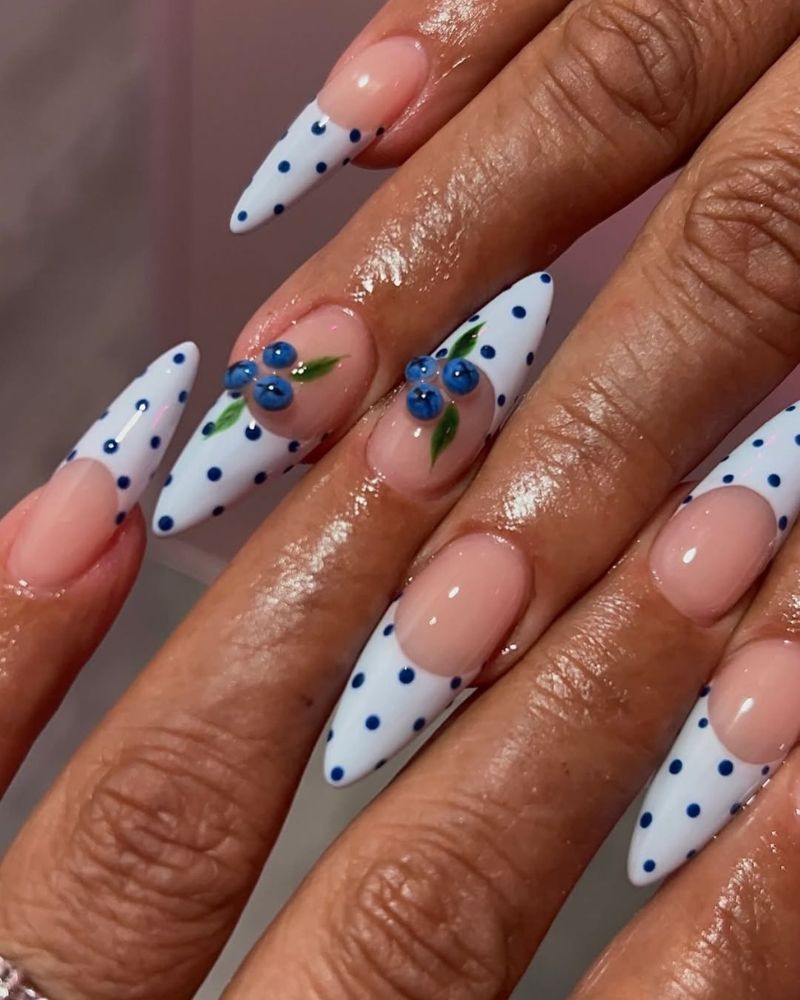 stiletto blueberry nails with light blue tips and polka dots