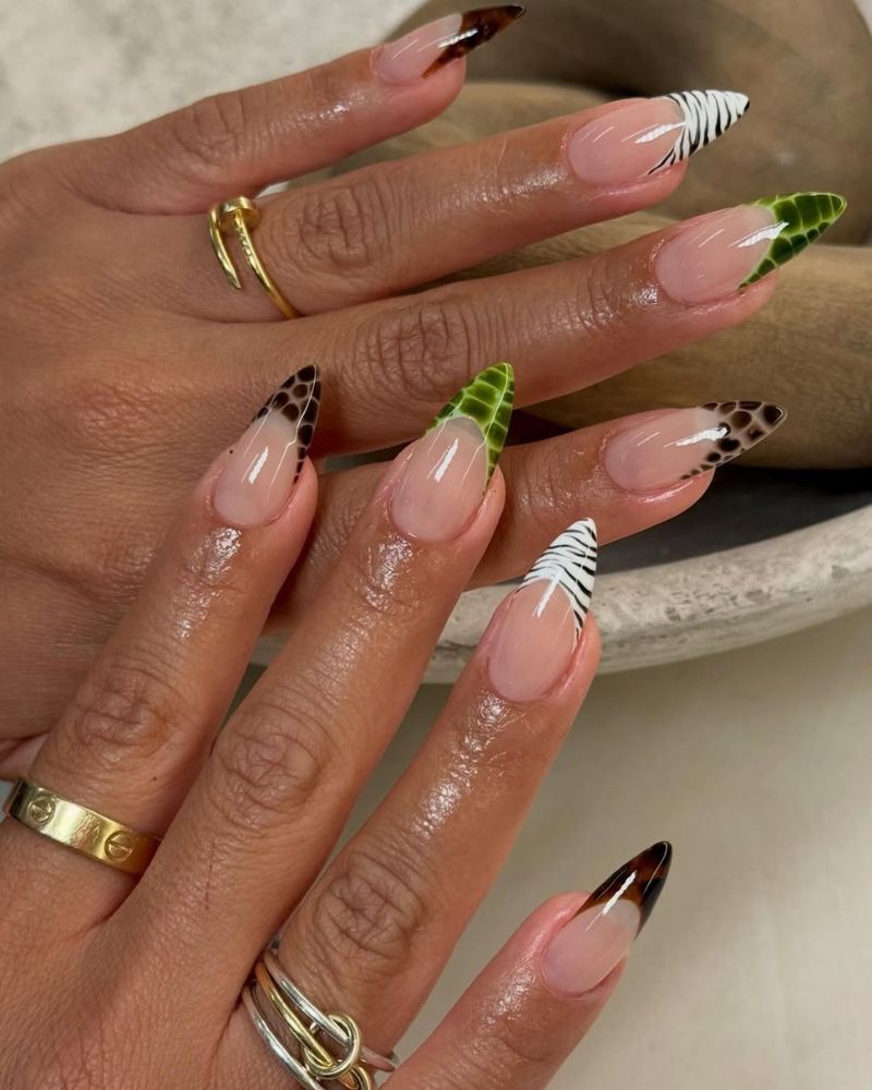 classy gel-x stiletto nails with animal print french tips