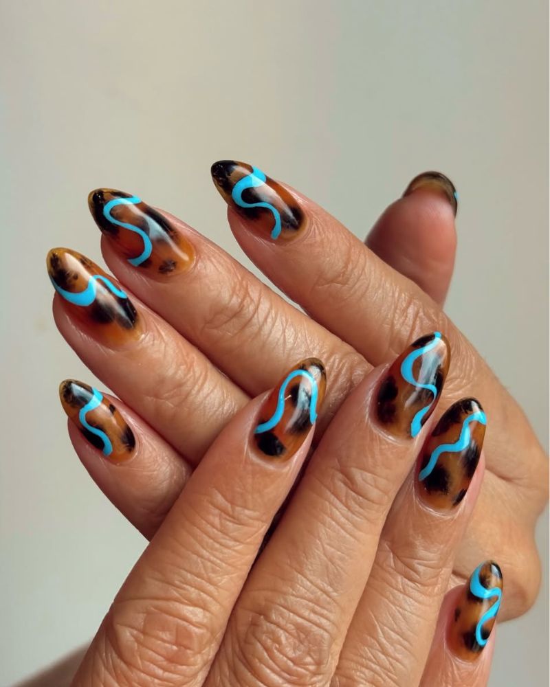 tortoise shell nails with blue swirly lines