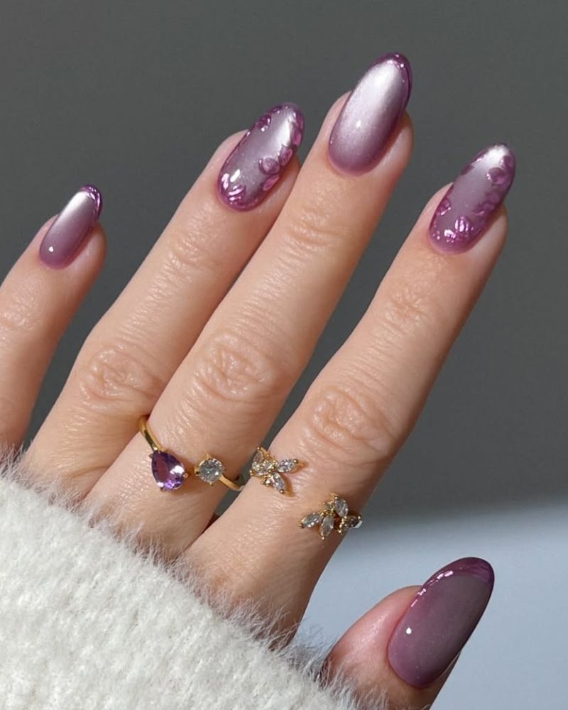 violet cat eye manicure with floral nail art