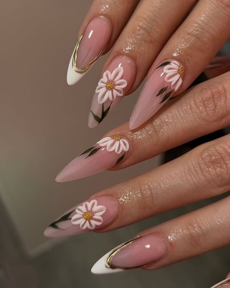 stiletto nude nails with daisy nail art and white french tips
