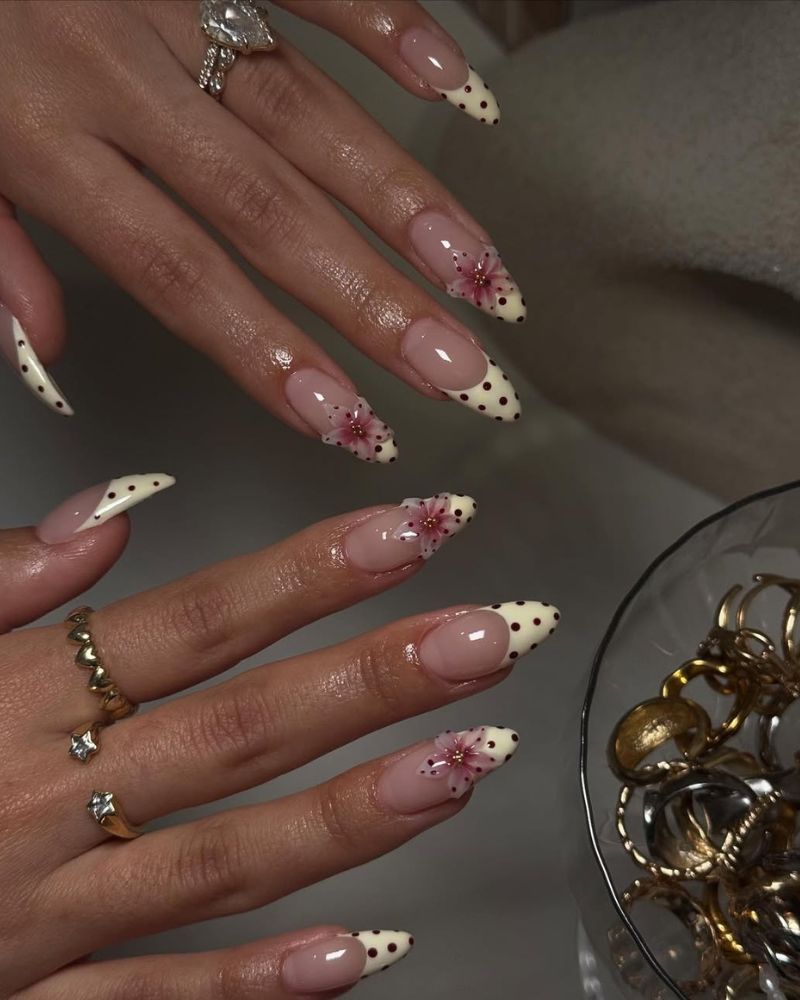 pastel yellow french tips with burgundy nail art