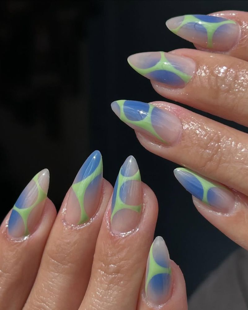 clean long stiletto nails with blue aura and green nail art for summer