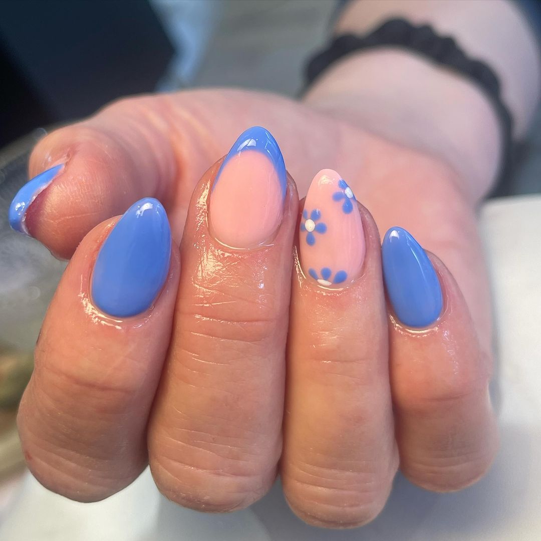 Periwinkle blue nails with floral accents