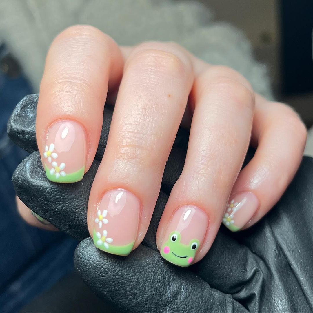 Cute frog with rosy cheeks on nails