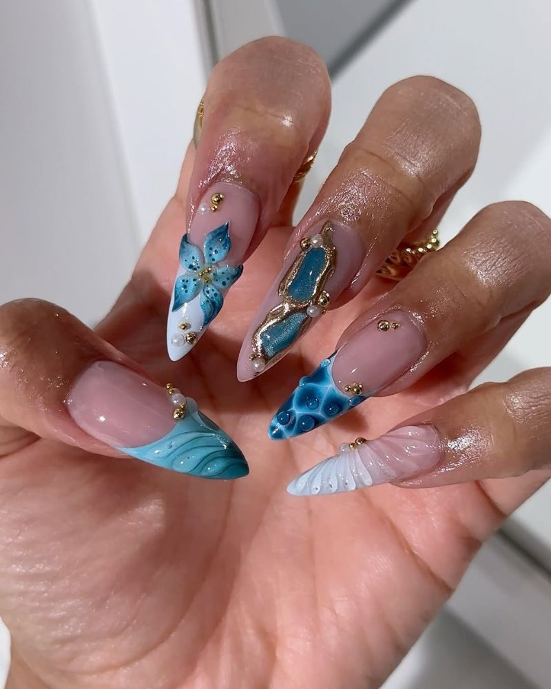 long stiletto nails with white french tips and blue nail art
