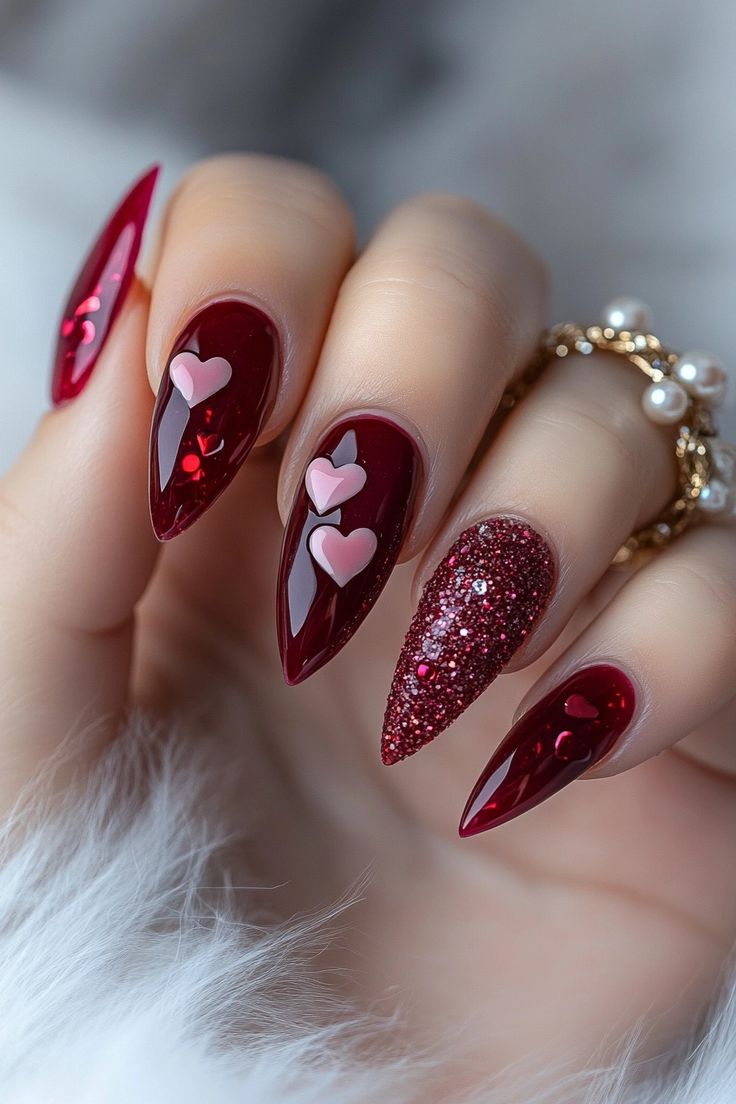13. Romantic Red Stiletto Nails with Glitter and Pink Heart Accents