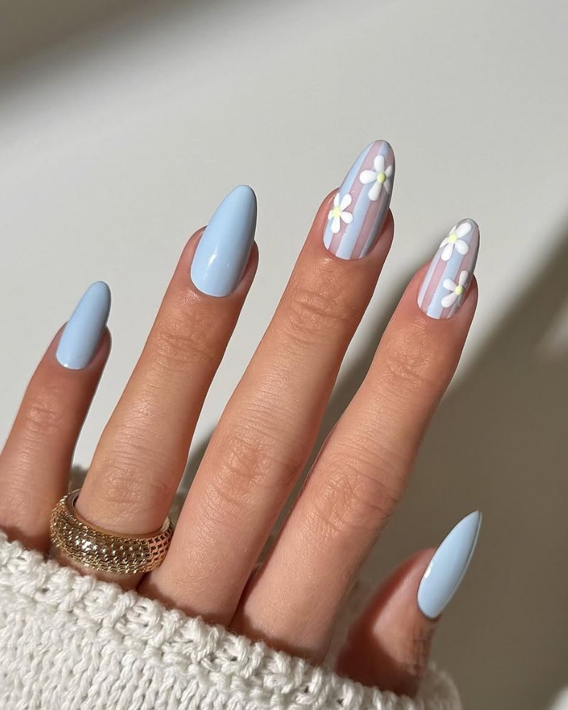 baby blue spring manicure with white flowers nail art