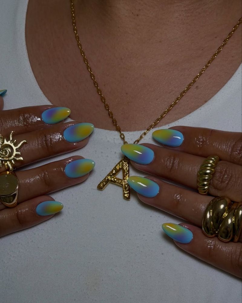 almond blue nails with green and purple aura art for summertime nail designs