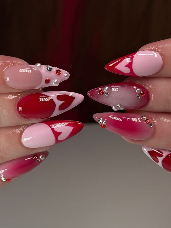 Red and Pink Valentine's Nail Design with Hearts and Gems