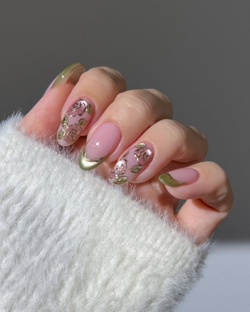 green cat eye nails on clean base with rose nail art design