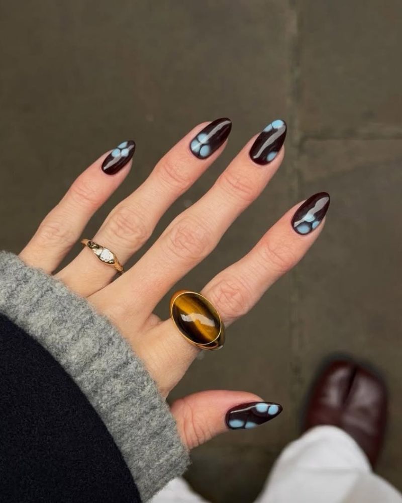 brown nails with blue floral nail art
