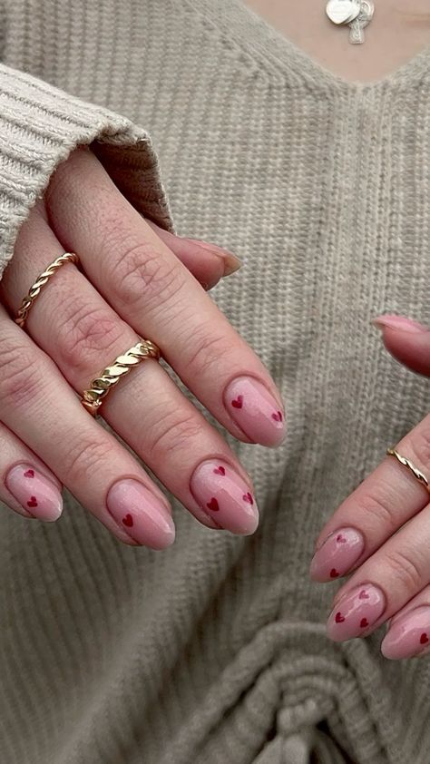 Delicate Pink Nails with Minimal Red Hearts for a Romantic Charm