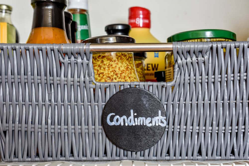 This small organized pantry closet on a budget with shelves and baskets is full of cheap and easy ideas to keep all your food visible and easy to access!