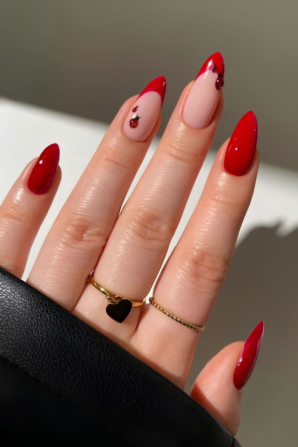 Red nails with ladybug art