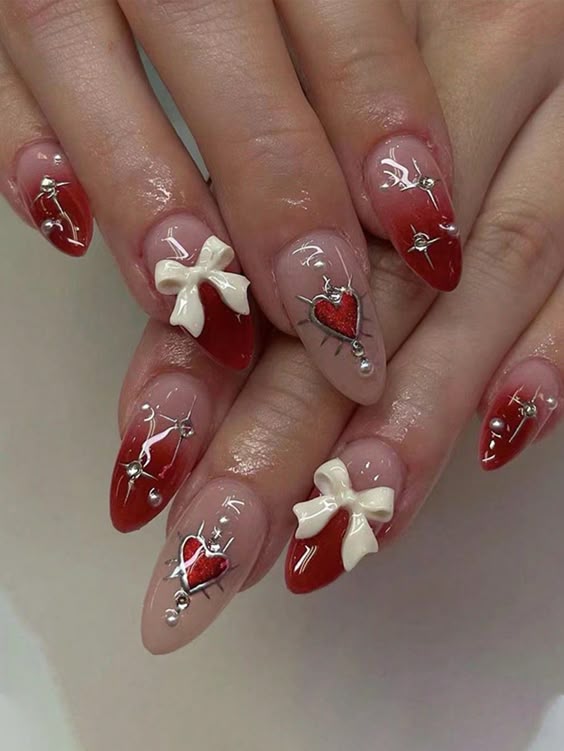 15. Romantic Elegance: Red Ombre Nails with Hearts and Bows