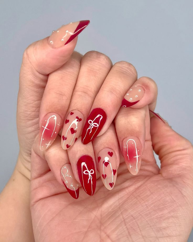 2. Romantic Elegance with Heart and Ribbon Red Valentine’s Day Nails