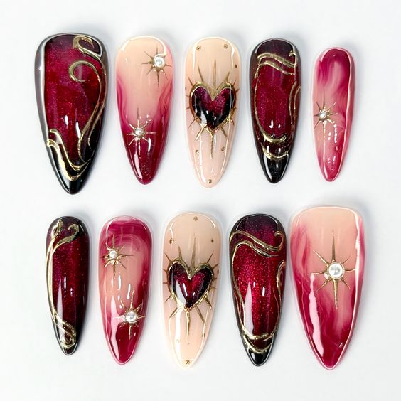 5. A Bold Gothic Romance: Burgundy Red and Gold Valentine Nails