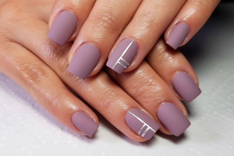 Matte mauve square nails with clean white minimalist line art for a chic modern look.