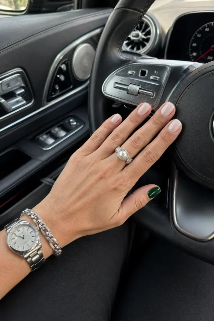 Milky Pink Nails with Emerald Accent