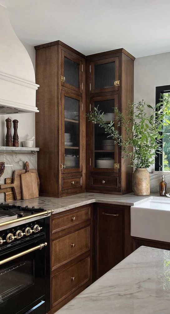 Furniture-style cabinetry in a Nancy Meyers kitchen
