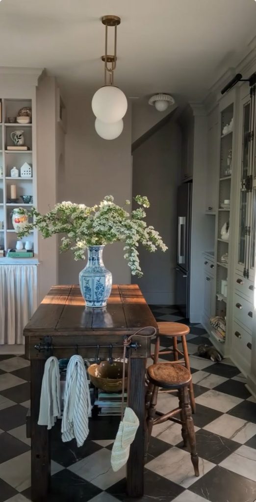 A welcoming kitchen island in a Nancy Meyers style kitchen
