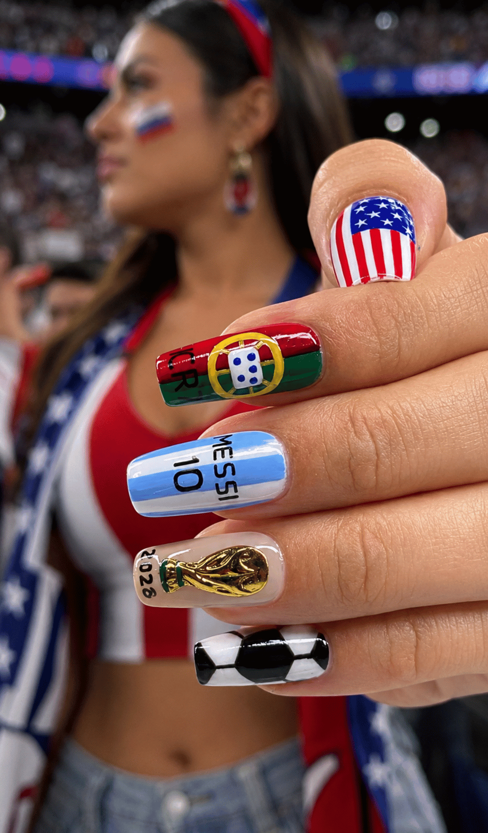 USA soccer spirit nails featuring red white and blue football fan nail art with American flag accents, championship trophy nail, and soccer ball design.