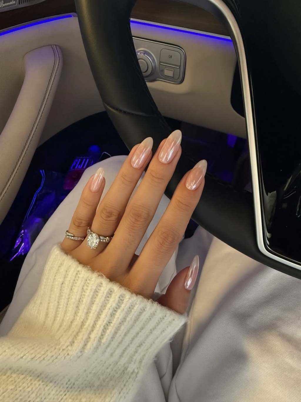 Classic glazed sheer nude simple nail design on long almond nails with a pearlescent chrome finish