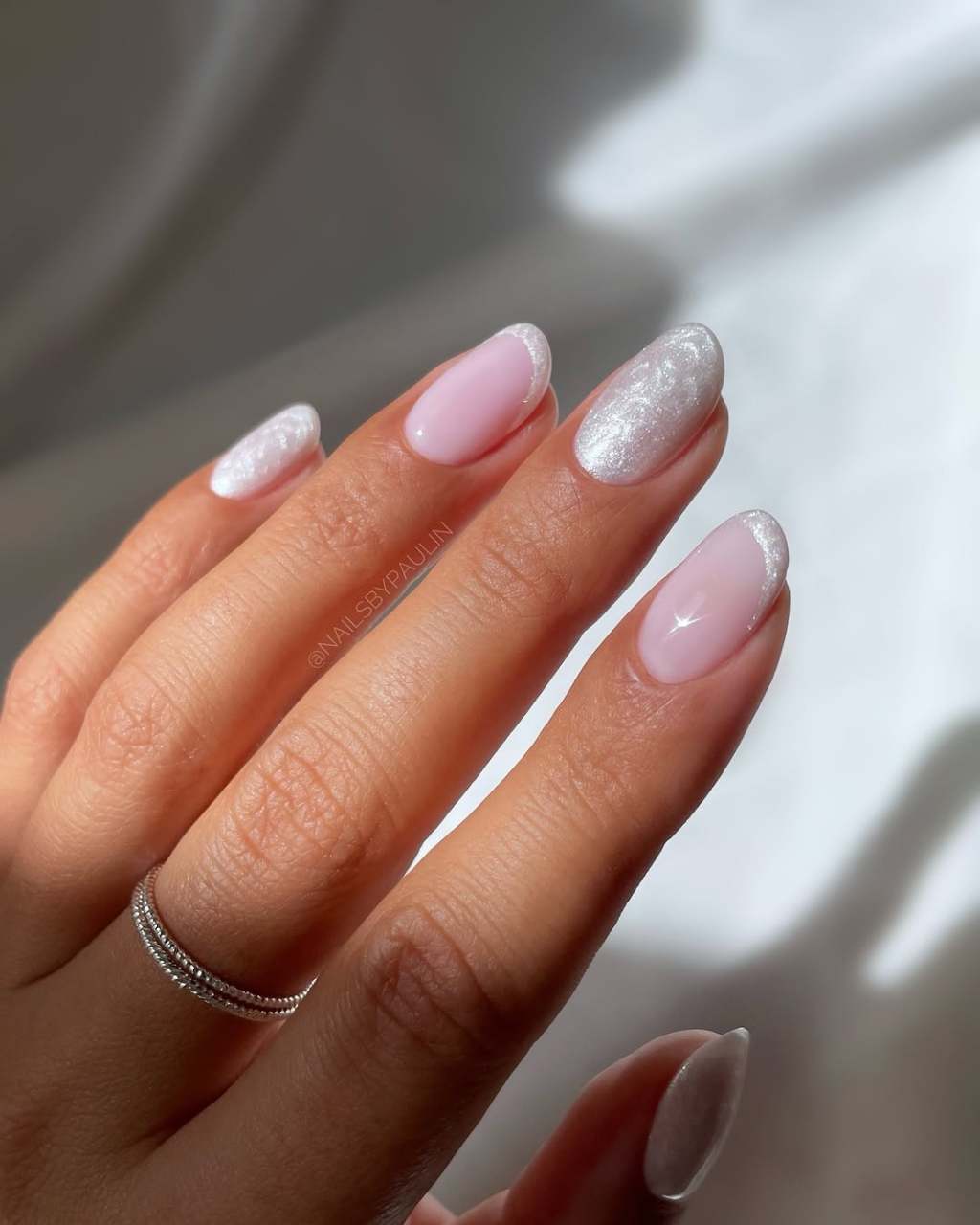 classy pearl white nails with trendy french tip simple nail designs on two fingers
