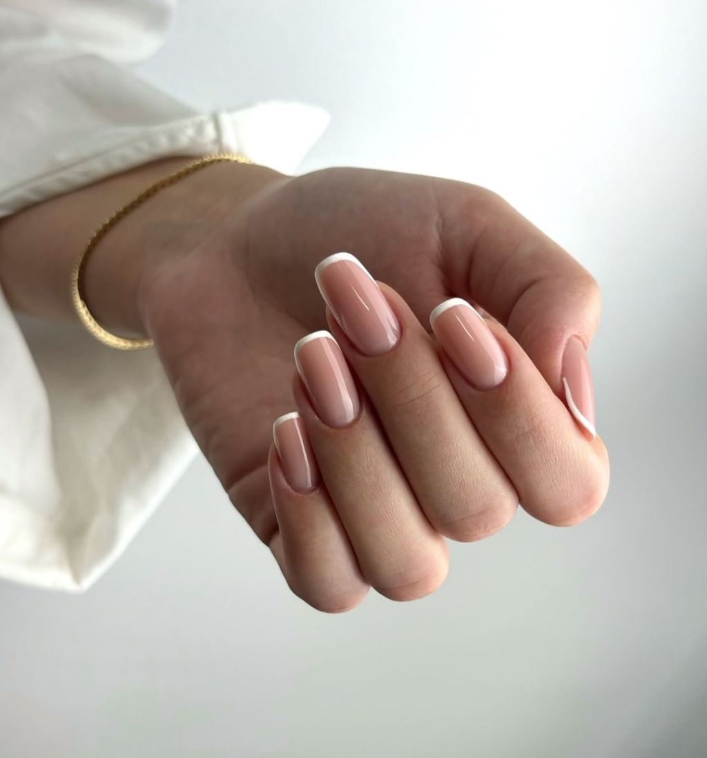 simple and classy squoval shaped white french manicure