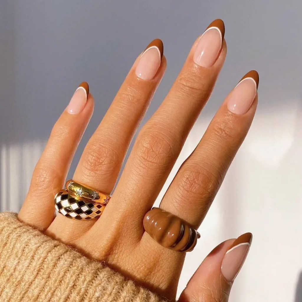 Latte French tip simple nail design on long almond nails with a sheer nude base